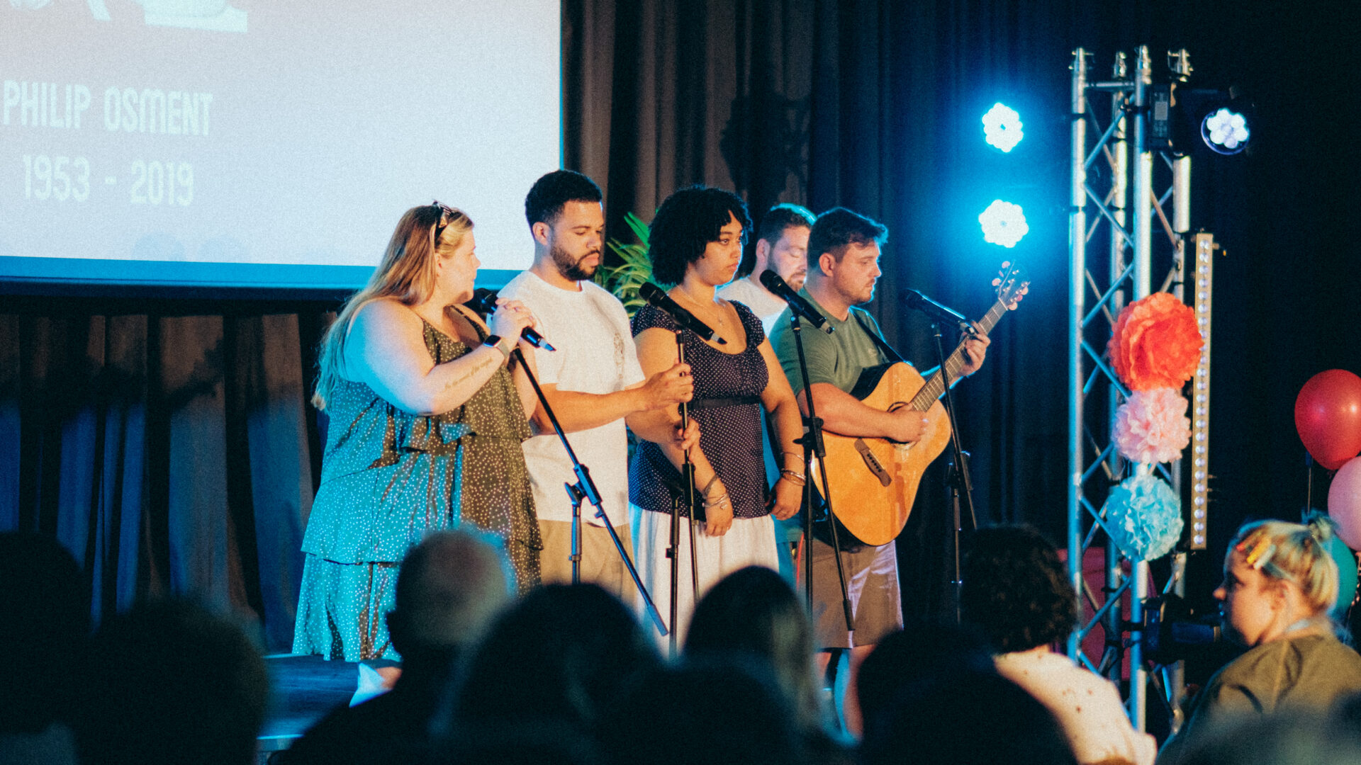 Group of people performing on stage